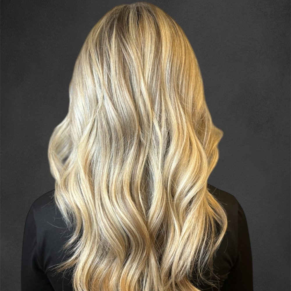 Long, softly waved dimensional blonde hair